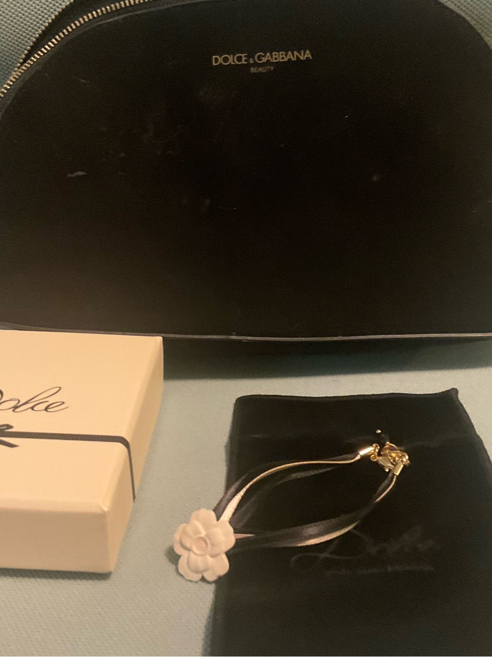 Dolce and Gabbana black and Gold Ribbon Wristlet White flower w pouch
